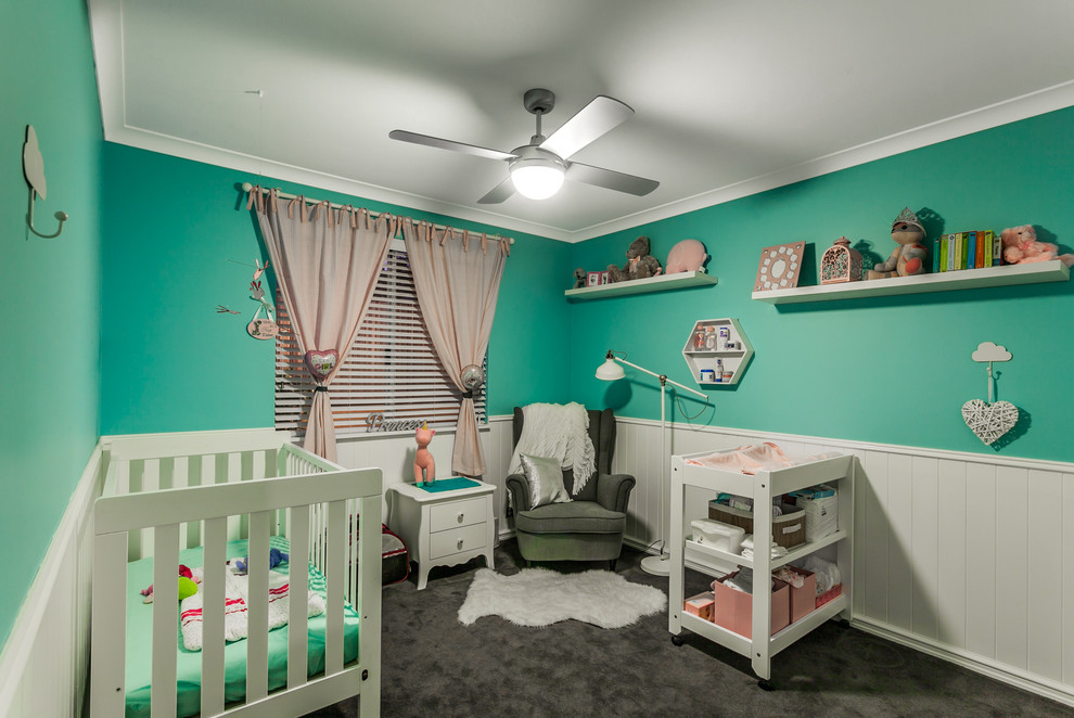 Design ideas for a traditional nursery for girls in Perth with green walls, carpet and grey floor.