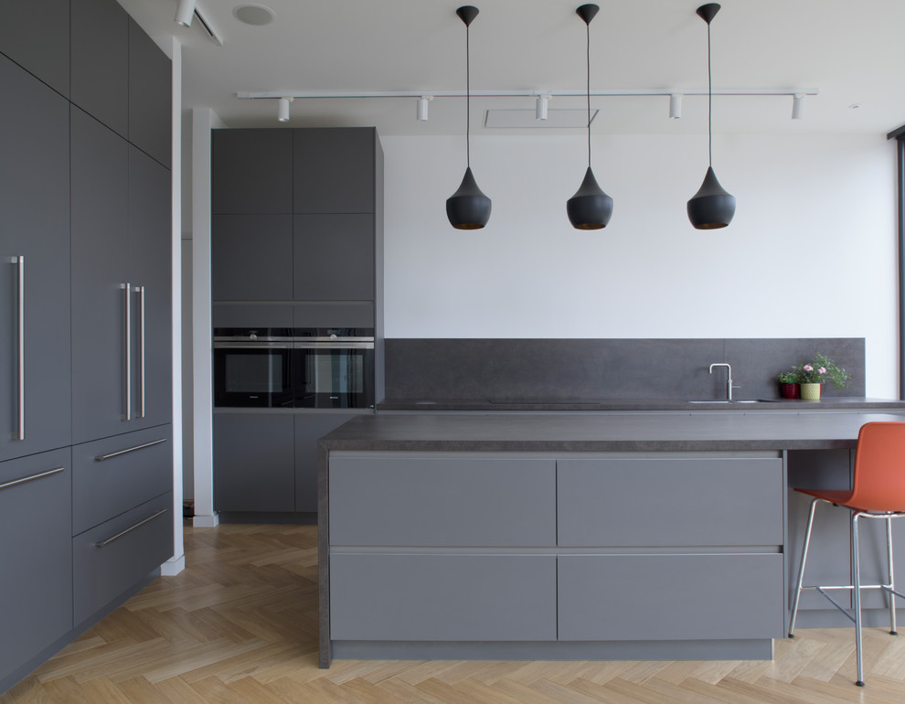 Design ideas for a large contemporary single-wall kitchen/diner in London with an island.