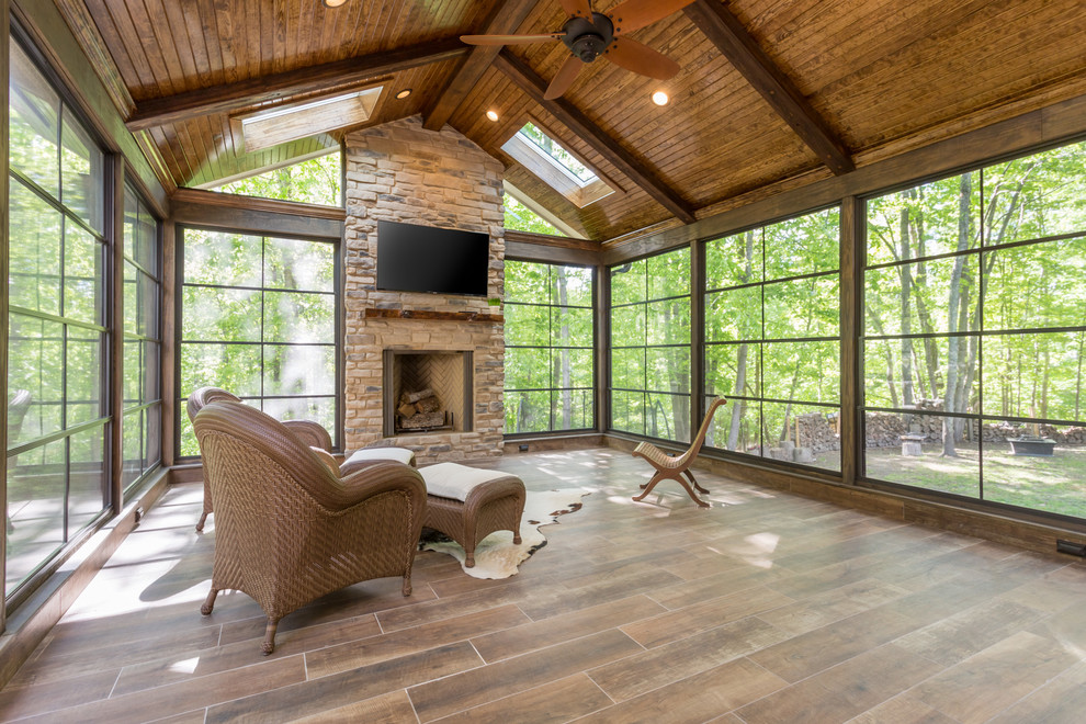 This is an example of a transitional sunroom in Raleigh.