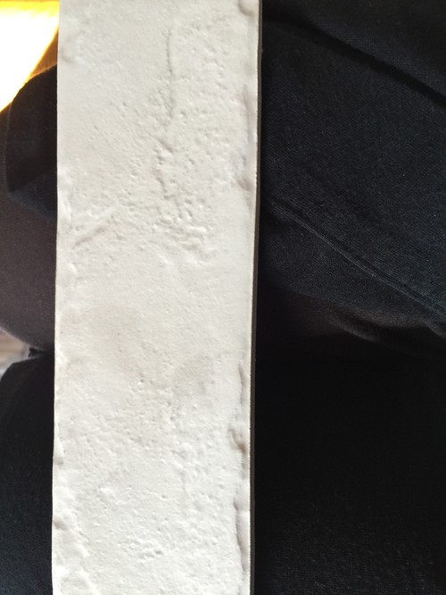 Textured white kitchen splashback tiles
