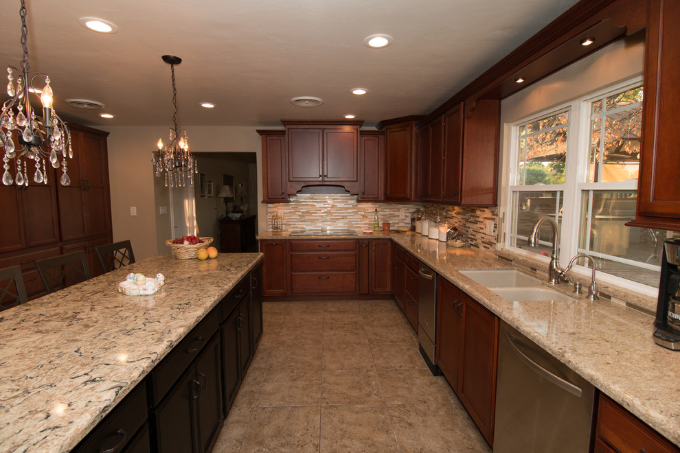 Kitchen - large transitional u-shaped porcelain tile kitchen idea with an undermount sink, flat-panel cabinets, medium tone wood cabinets, quartz countertops, beige backsplash, mosaic tile backsplash, stainless steel appliances and an island