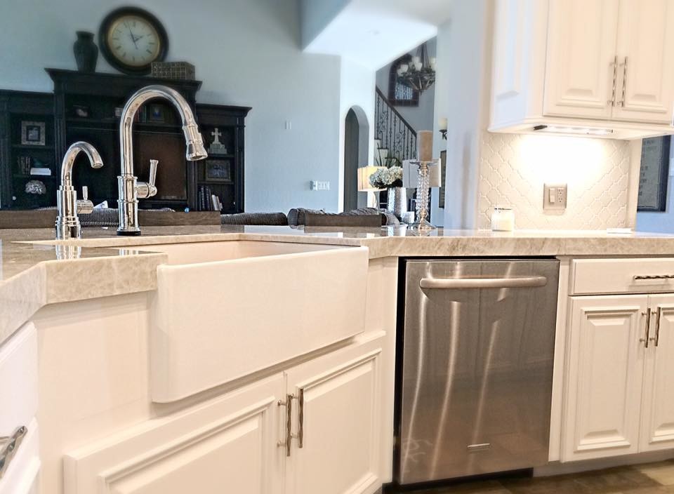 Inspiration for a mid-sized transitional u-shaped slate floor eat-in kitchen remodel in Houston with a farmhouse sink, raised-panel cabinets, white cabinets, quartzite countertops, gray backsplash, porcelain backsplash, stainless steel appliances and an island