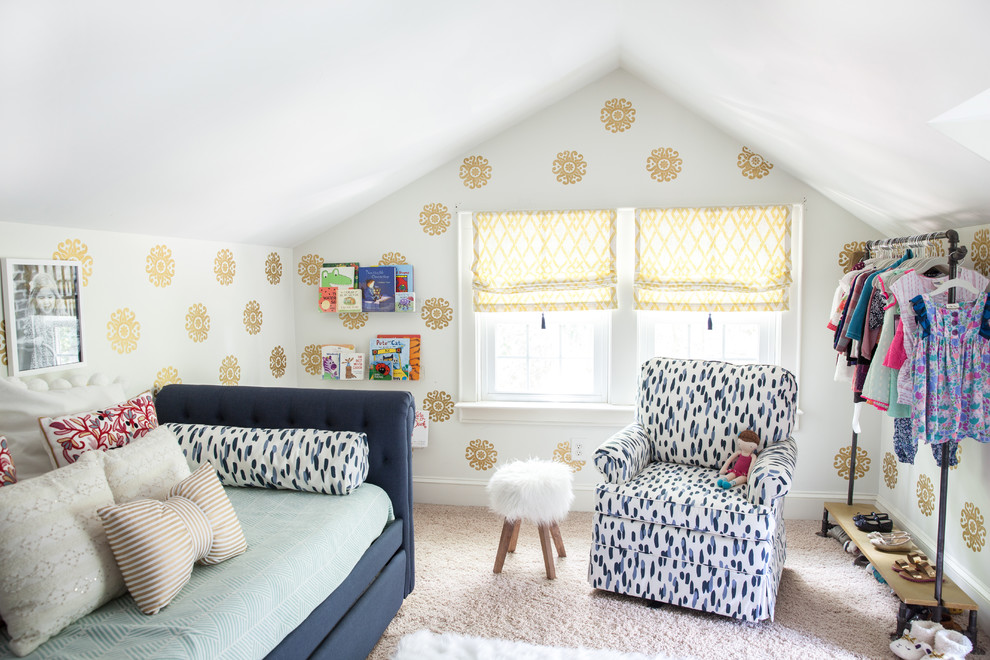 Transitional kids' room in Charlotte with multi-coloured walls and carpet for girls.