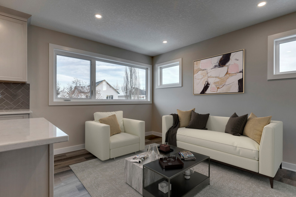 This is an example of a small contemporary open plan living room in Calgary with grey walls, vinyl flooring and grey floors.