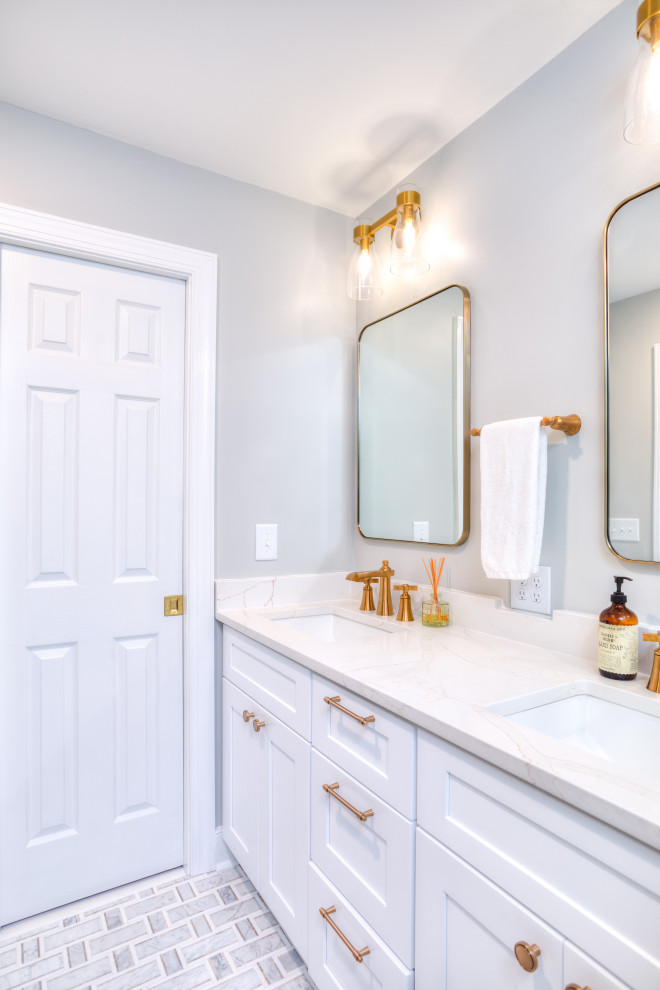 This is an example of a mid-sized modern master bathroom in Raleigh with shaker cabinets, white cabinets, a corner shower, a bidet, white tile, ceramic tile, grey walls, mosaic tile floors, an undermount sink, engineered quartz benchtops, grey floor, a hinged shower door, white benchtops, a niche, a double vanity and a built-in vanity.