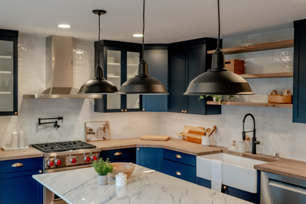 Industrial Matte Black Pendant Lighting over Navy Kitchen Island ...