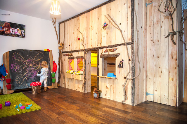 Indoor forest cottage playroom with giant blackboard and rustic storage ...