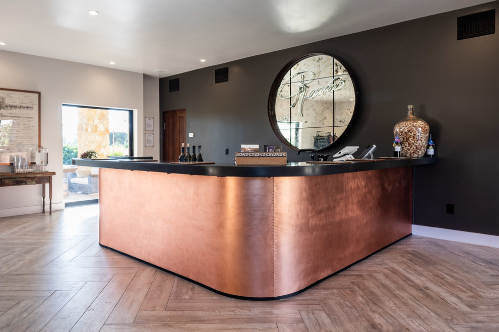 Example of a mid-sized urban u-shaped wet bar design in San Luis Obispo with shaker cabinets, dark wood cabinets, concrete countertops and black countertops