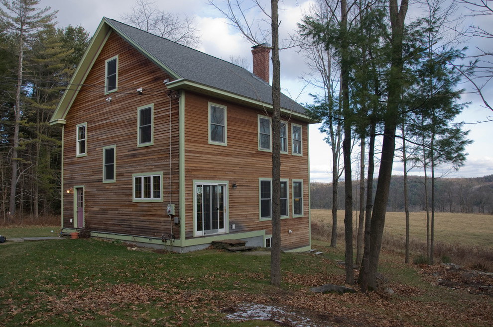 This is an example of a traditional exterior in Burlington with wood siding.
