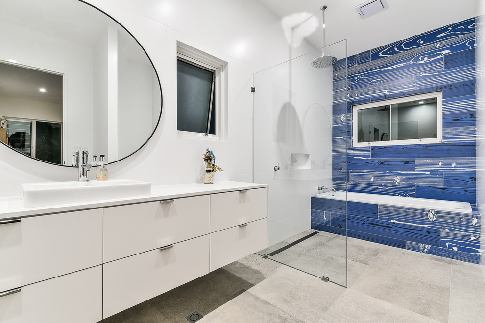 Contemporary master bathroom in Perth with flat-panel cabinets, white cabinets, an alcove tub, an open shower, white walls, concrete floors, a drop-in sink and an open shower.