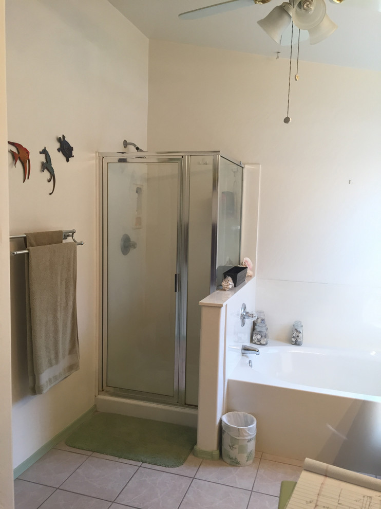 Small transitional master beige tile and porcelain tile porcelain tile doorless shower photo in Phoenix with raised-panel cabinets, brown cabinets, gray walls, an undermount sink and granite countertops