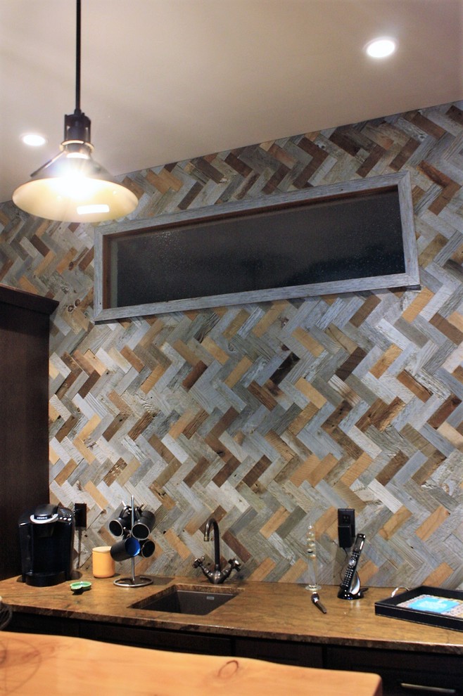 Inspiration for a mid-sized rustic vinyl floor home bar remodel with an undermount sink, granite countertops, green backsplash and stone tile backsplash