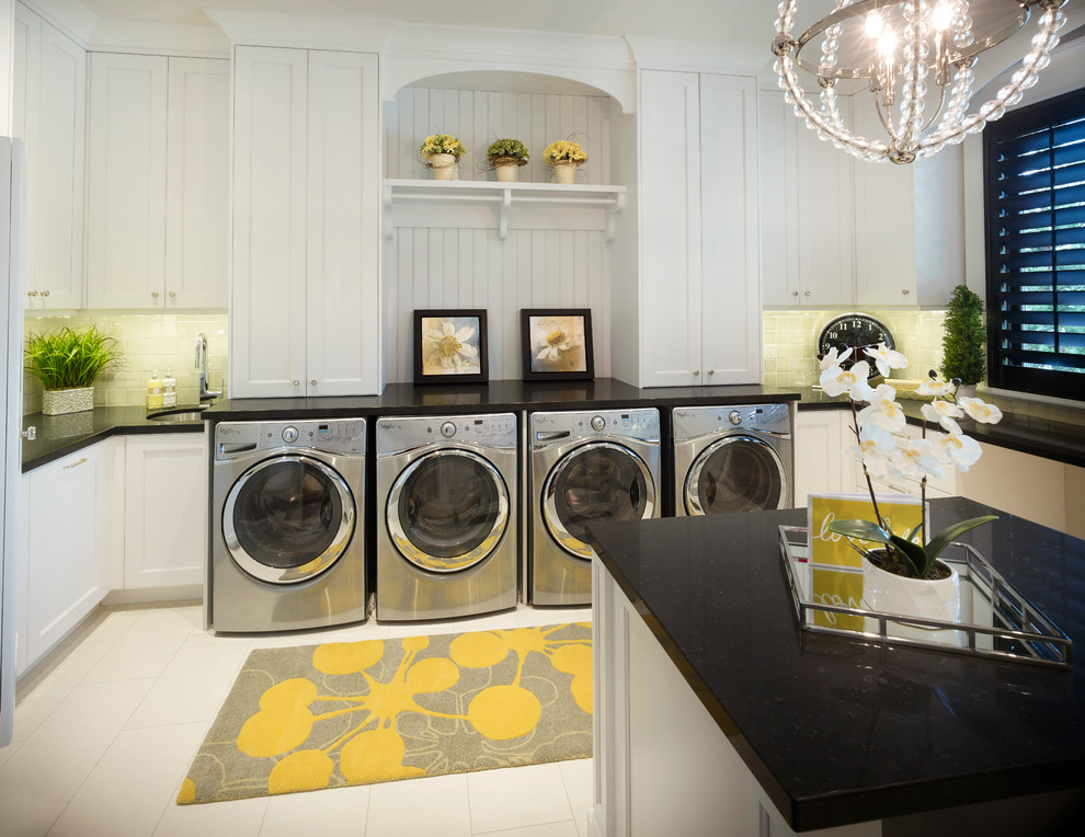 Photo of a traditional dedicated laundry room in Salt Lake City with recessed-panel cabinets, white cabinets, granite benchtops, white walls, ceramic floors, a side-by-side washer and dryer and white floor.