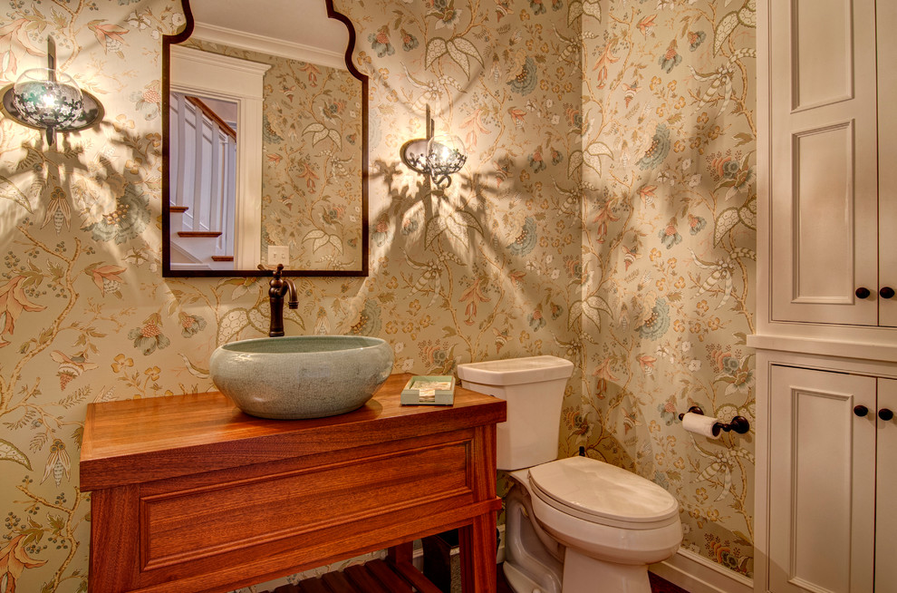 Design ideas for a traditional powder room in Other with a vessel sink.