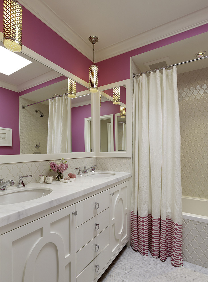 This is an example of a contemporary kids bathroom in San Francisco with white cabinets, an alcove tub, a shower/bathtub combo and pink walls.