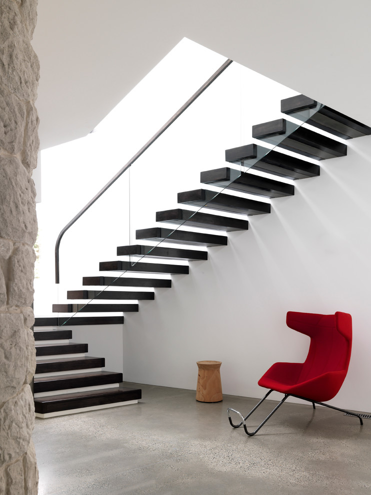 Design ideas for a contemporary floating staircase in Sydney with open risers and glass railing.
