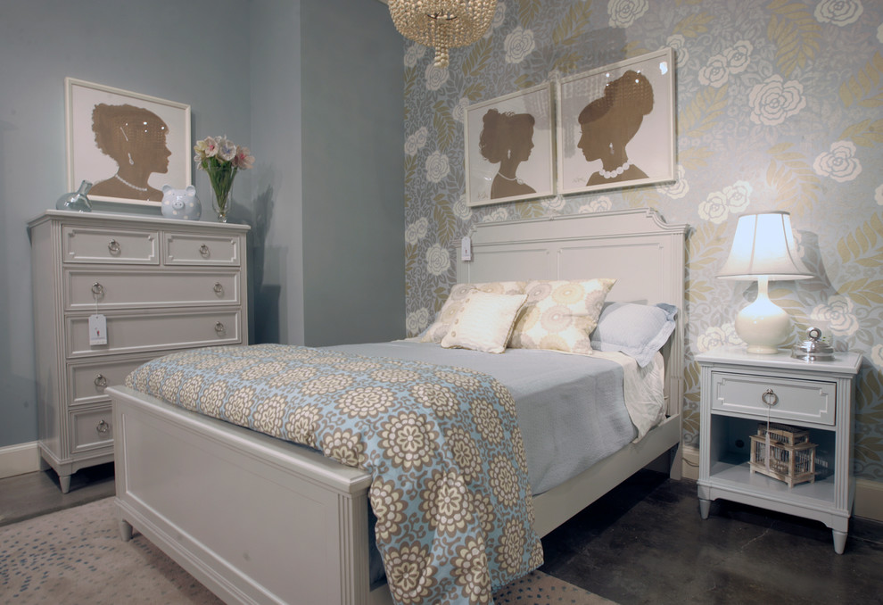 Photo of a mid-sized modern kids' room for girls in Other with blue walls and concrete floors.
