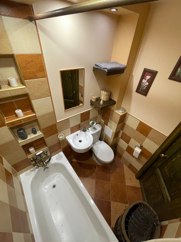 Toilet room - eclectic master multicolored tile and ceramic tile ceramic tile, multicolored floor and single-sink toilet room idea with dark wood cabinets, an undermount tub, beige walls and a wall-mount sink