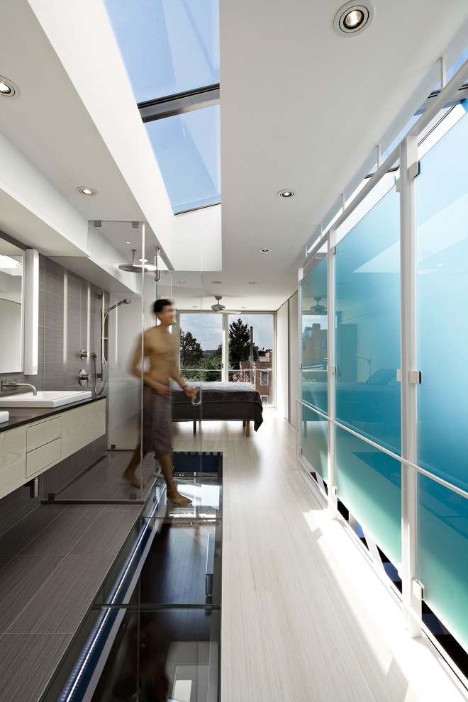 Inspiration for a modern bathroom in DC Metro with an open shower and an open shower.