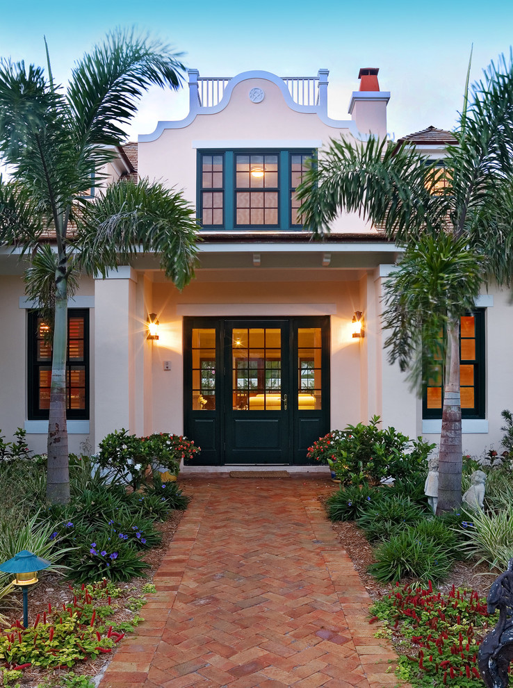 Inspiration for a mediterranean two-storey exterior in Miami.