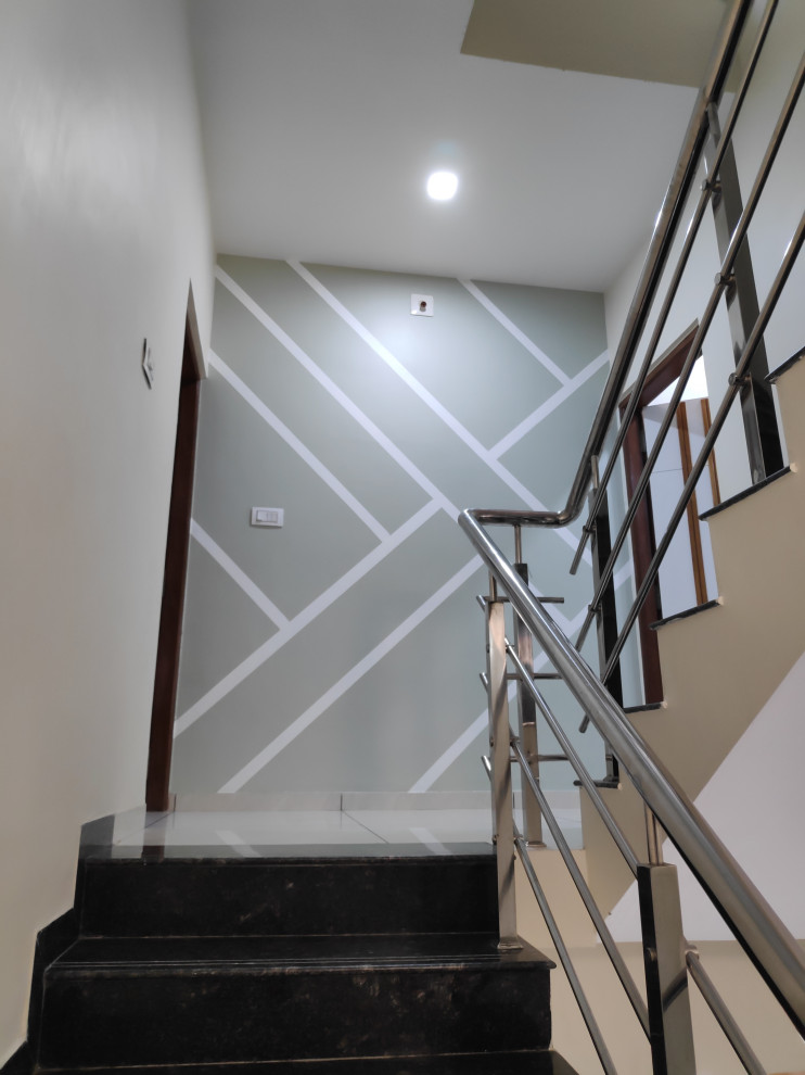 Design ideas for a modern staircase in Ahmedabad.