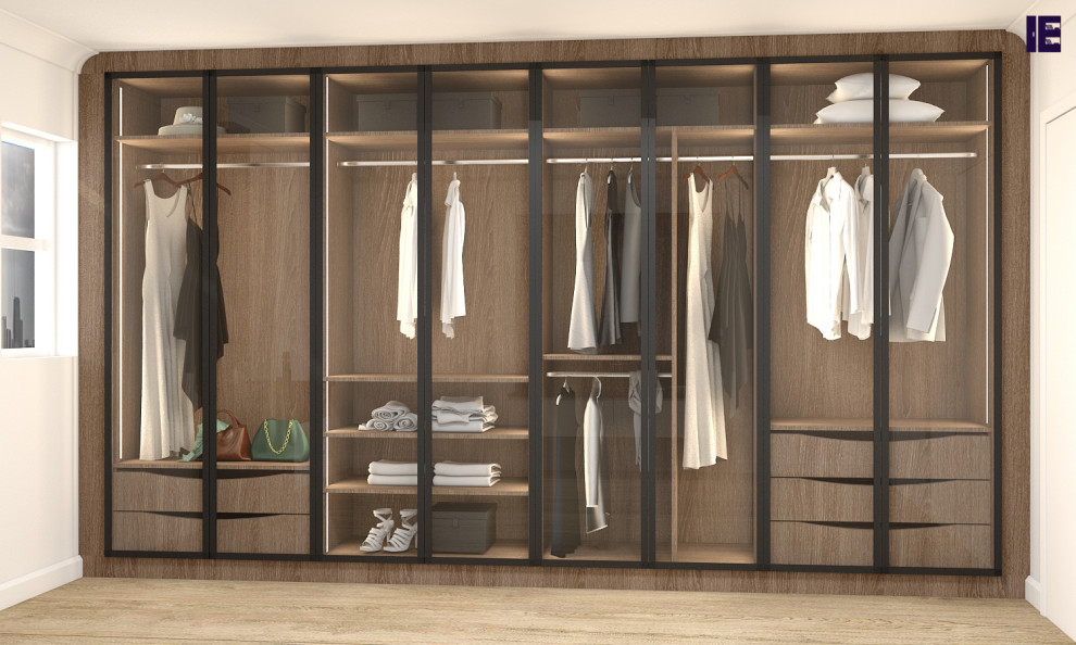 Small modern built-in wardrobe in London with glass-front cabinets, brown cabinets, plywood flooring, brown floors and feature lighting.