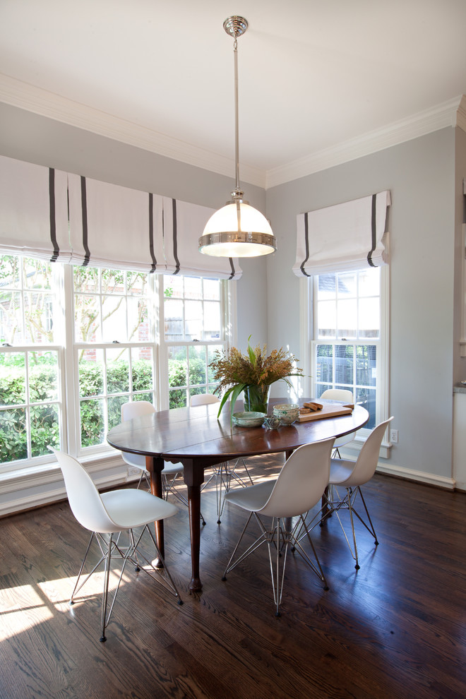 Contemporary dining room in Houston with grey walls and dark hardwood floors.