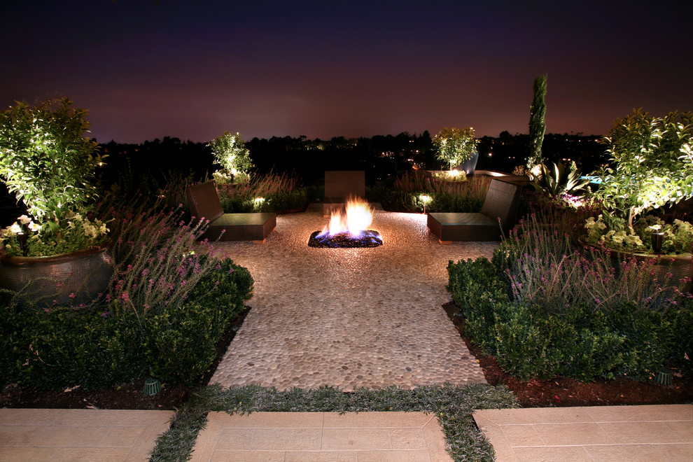 Design ideas for a mediterranean patio in Los Angeles with a fire feature.