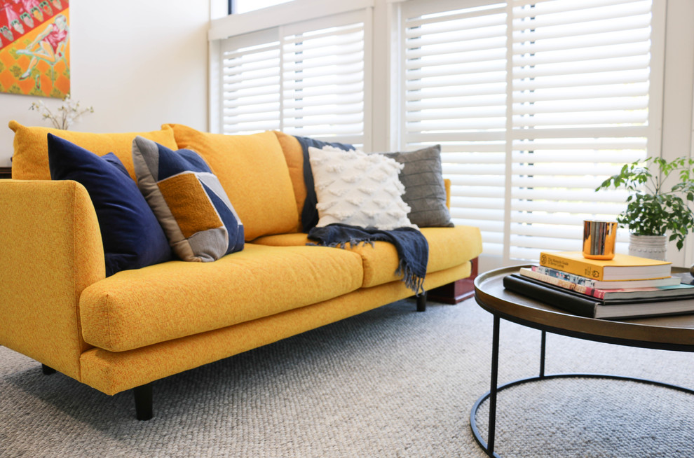 Large modern formal loft-style living room in Sydney with white walls, dark hardwood floors and brown floor.