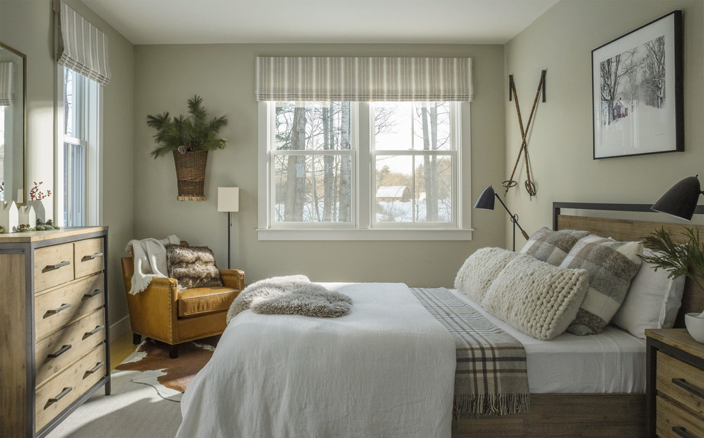 Country bedroom in Burlington with beige walls, medium hardwood floors and brown floor.