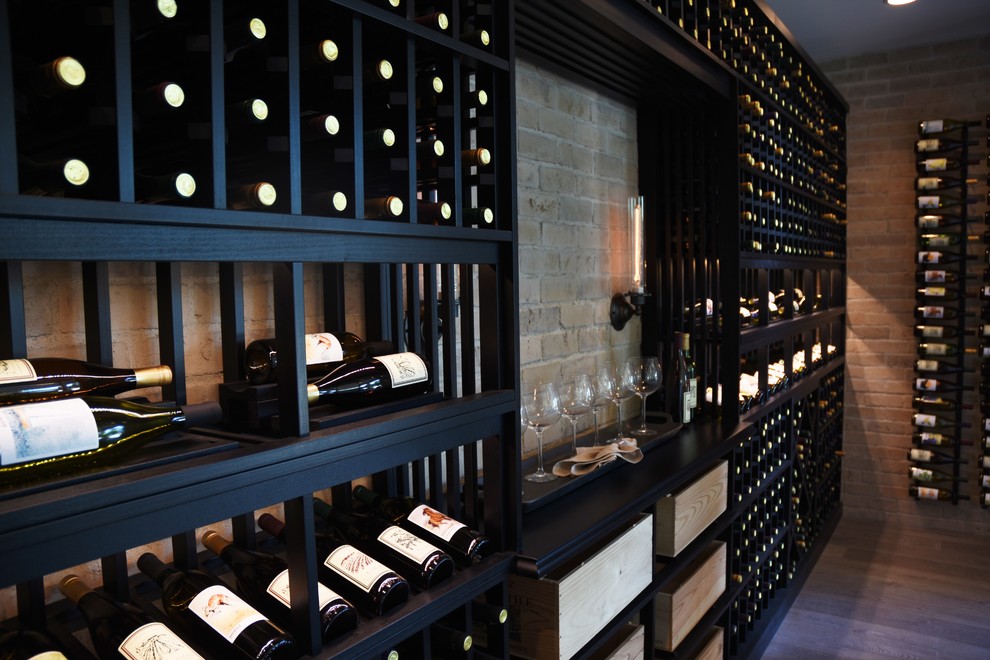 Inspiration for a large contemporary wine cellar in Orange County with medium hardwood floors, display racks and brown floor.