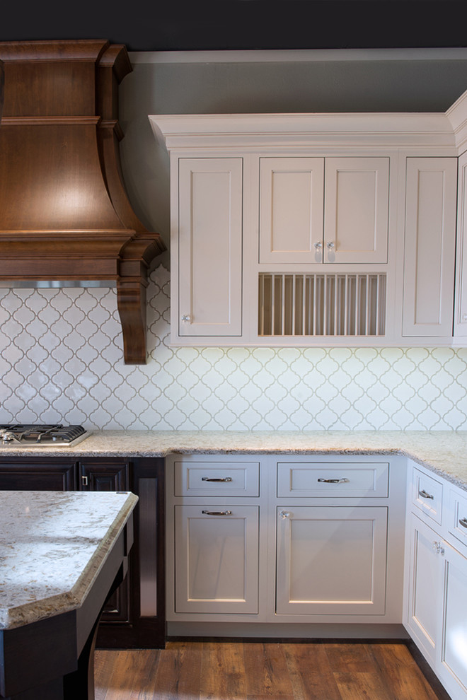 Kitchen - transitional kitchen idea in Cedar Rapids with beaded inset cabinets, beige cabinets, solid surface countertops, beige backsplash and mosaic tile backsplash
