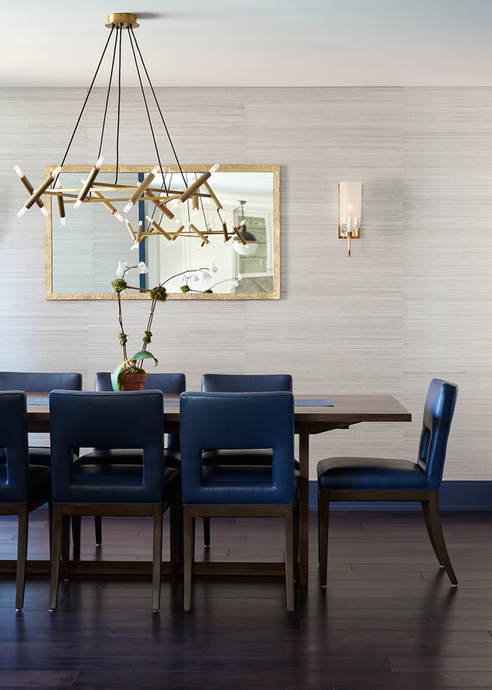 This is an example of a contemporary dining room in New York with grey walls and dark hardwood floors.