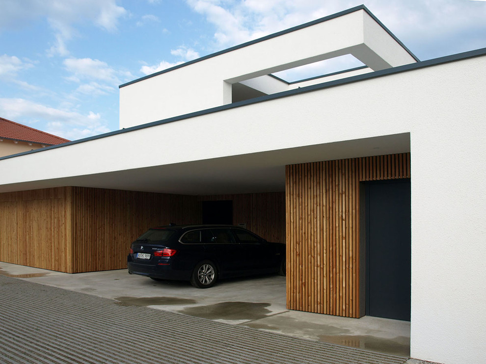 Design ideas for a contemporary attached two-car garage in Munich.
