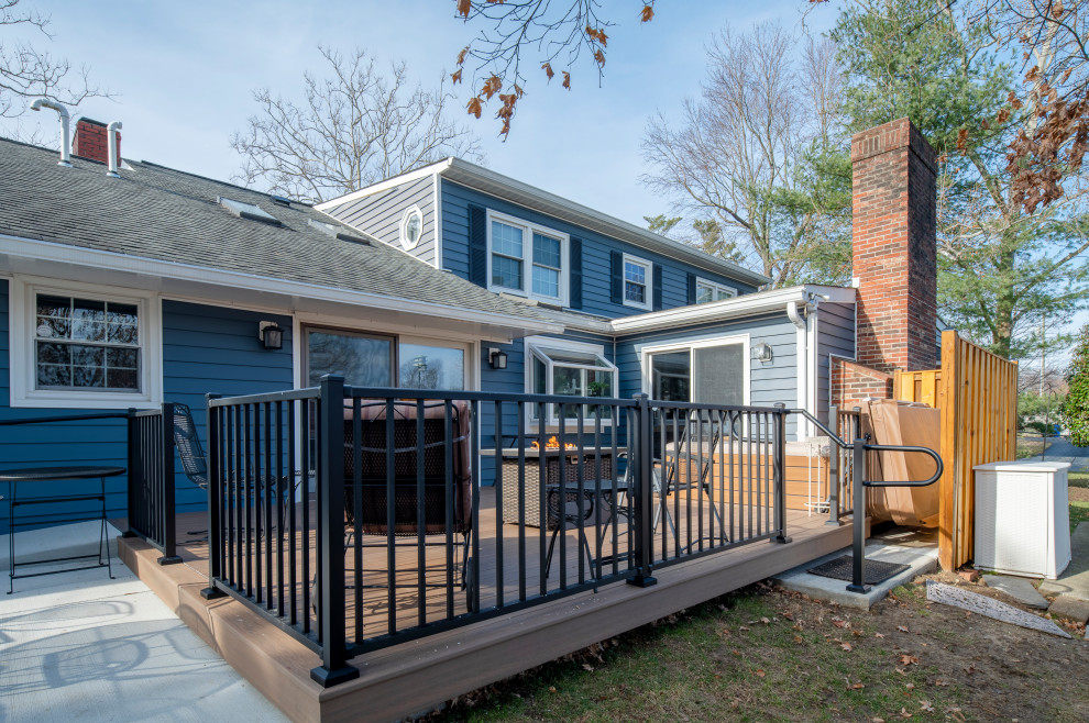 Example of a large backyard ground level metal railing deck design in DC Metro