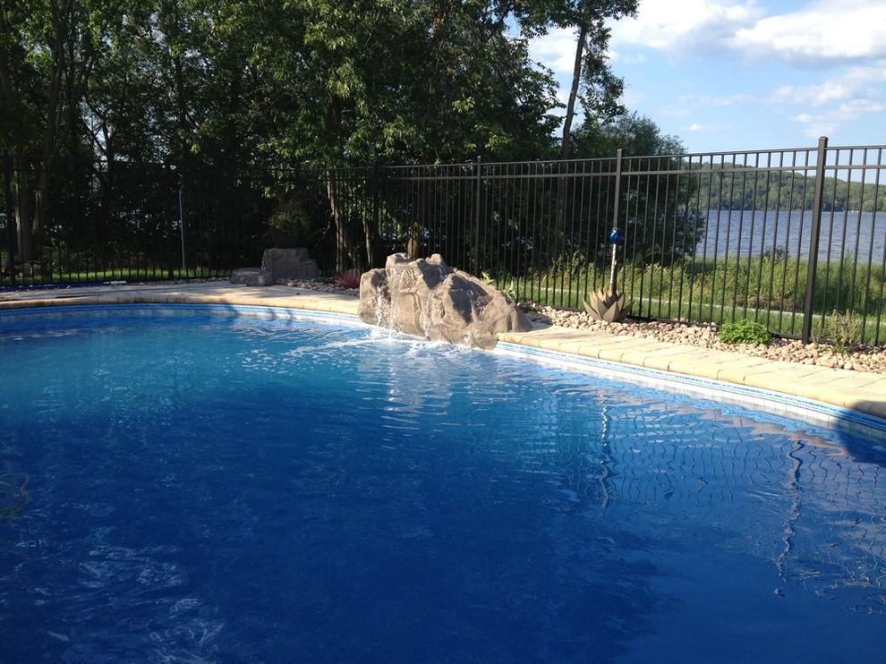 Inspiration for a transitional courtyard tile and kidney-shaped pool remodel in Toronto