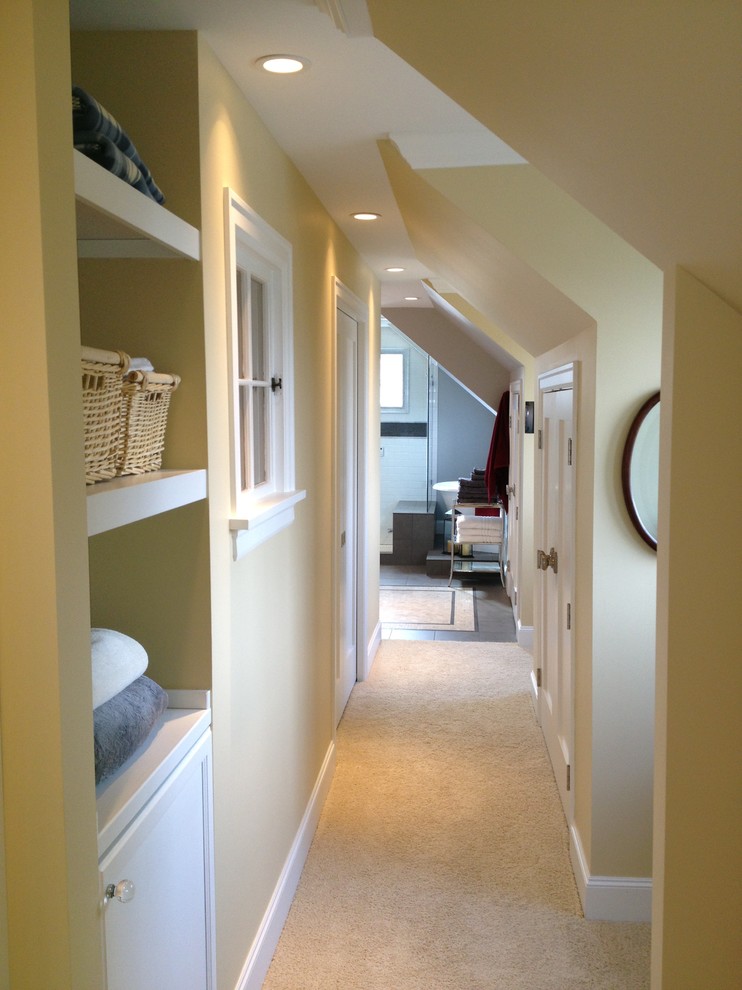 Small traditional hallway in Seattle with yellow walls and carpet.