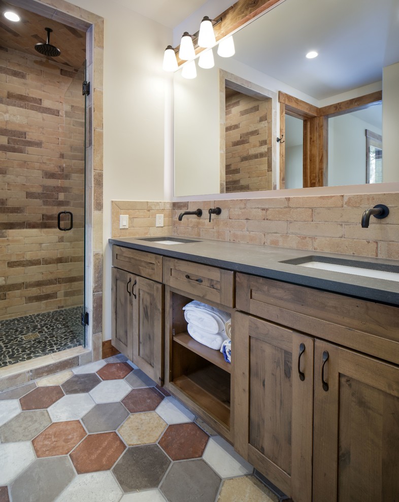 Bathroom - mid-sized rustic 3/4 beige tile and porcelain tile bathroom idea in Denver with shaker cabinets, medium tone wood cabinets, quartz countertops and gray countertops