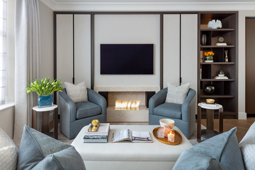 Design ideas for a medium sized contemporary open plan games room in London with beige walls, medium hardwood flooring, a ribbon fireplace, a stone fireplace surround, a wall mounted tv, brown floors and wallpapered walls.