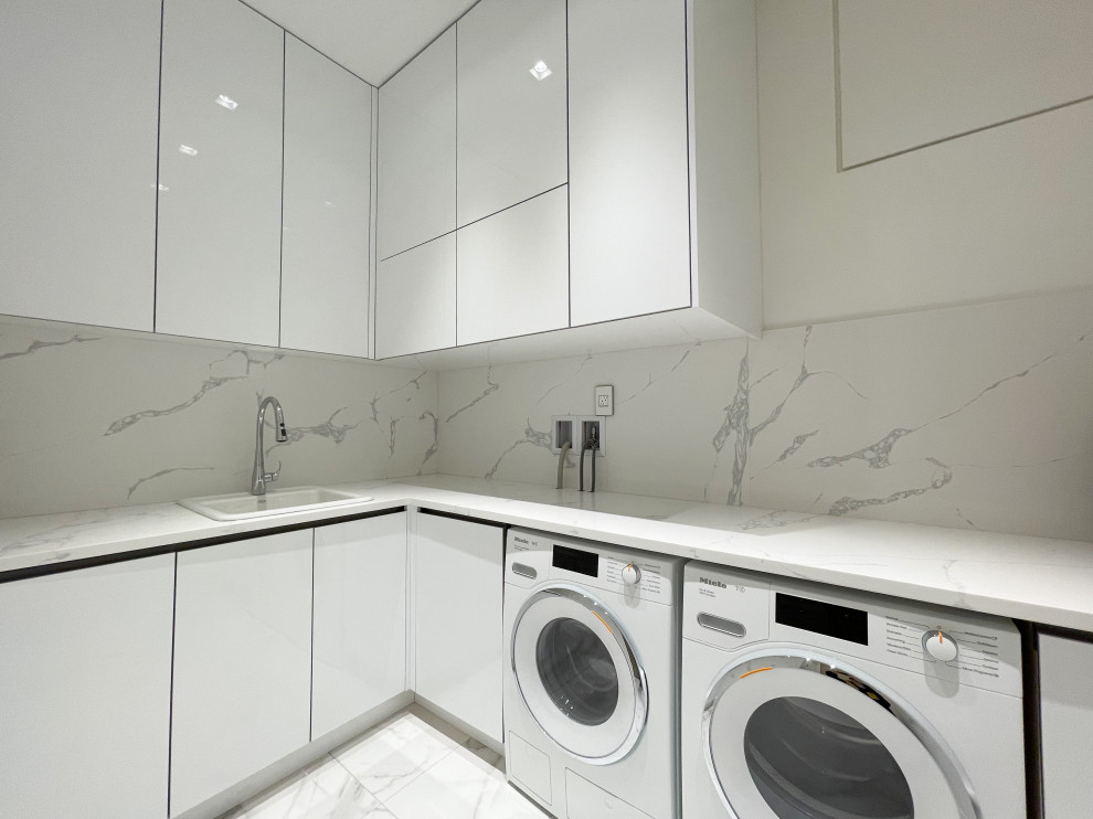 Dedicated laundry room - mid-sized modern l-shaped dedicated laundry room idea in Vancouver with open cabinets and white cabinets