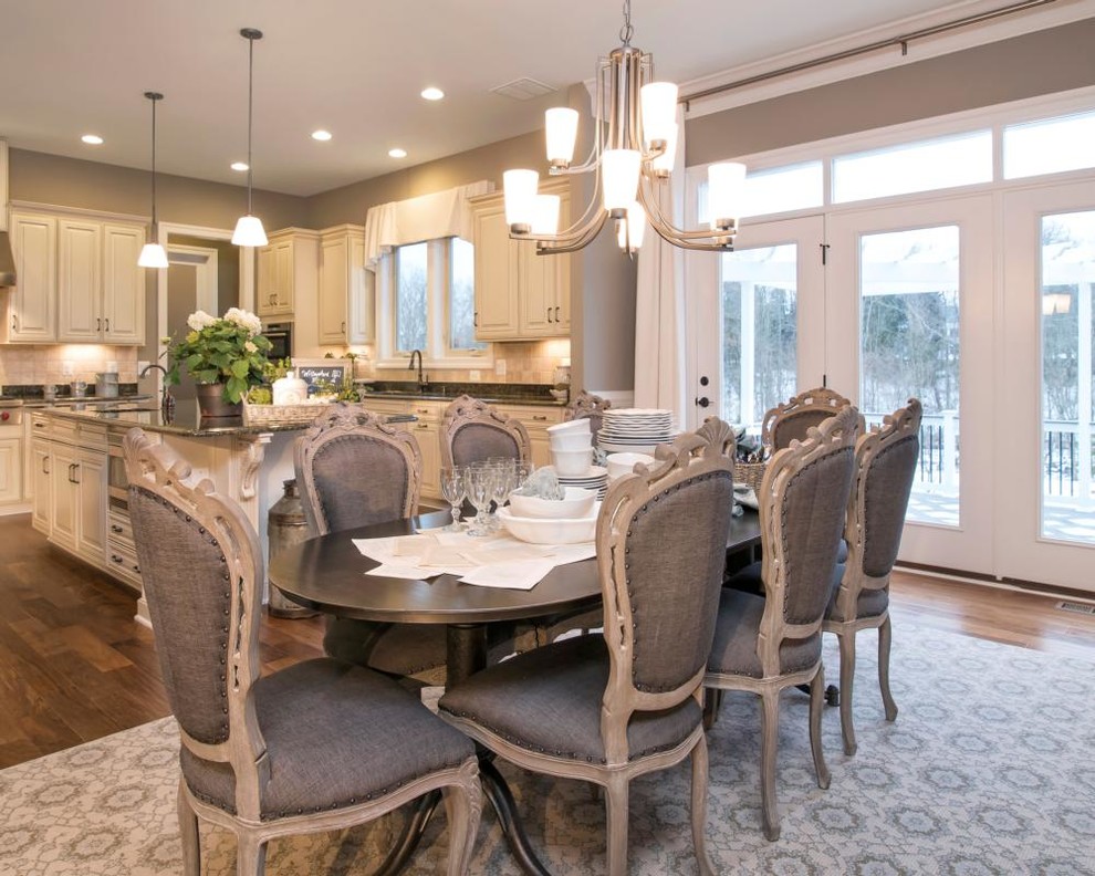 Example of a transitional kitchen design with an island