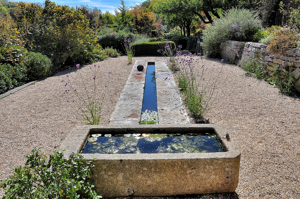 This is an example of a traditional gravel water fountain landscape in New York.
