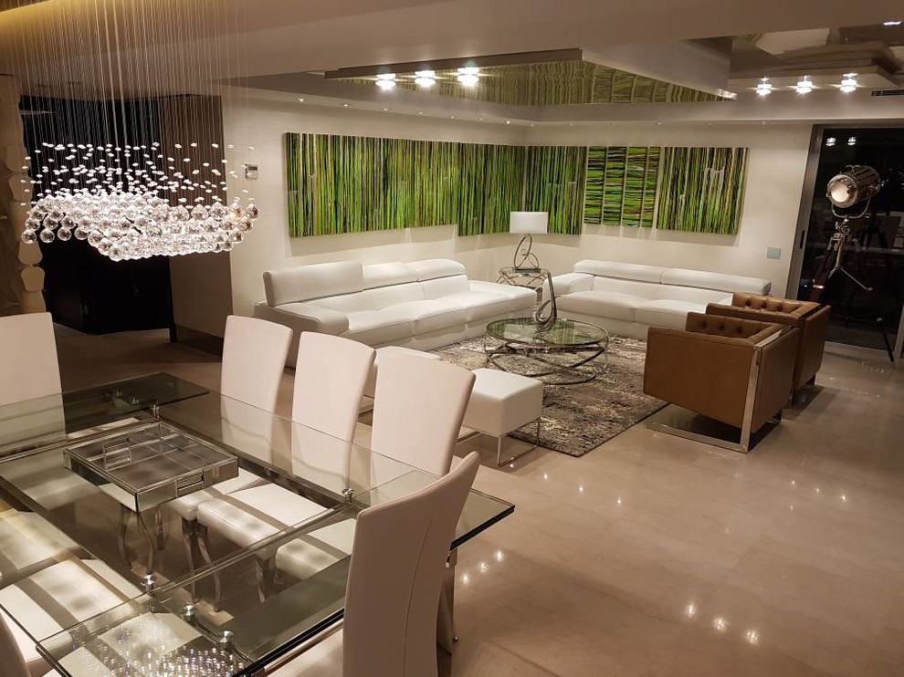 This is an example of a large modern formal loft-style living room in Miami with travertine floors, beige floor, white walls, no fireplace and no tv.