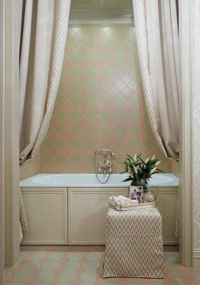 This is an example of a traditional master bathroom in Moscow with an alcove tub.