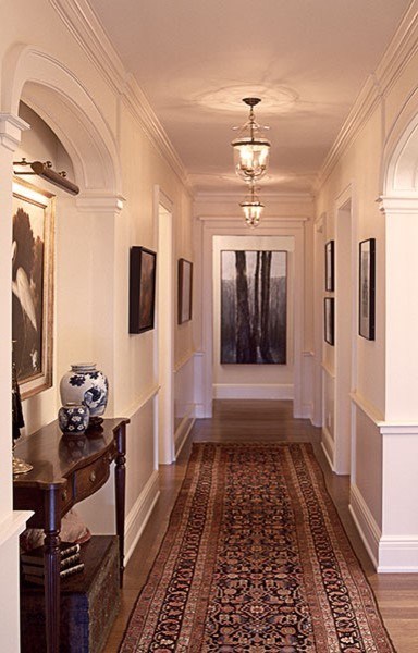 Small traditional hallway in Portland with white walls and medium hardwood floors.