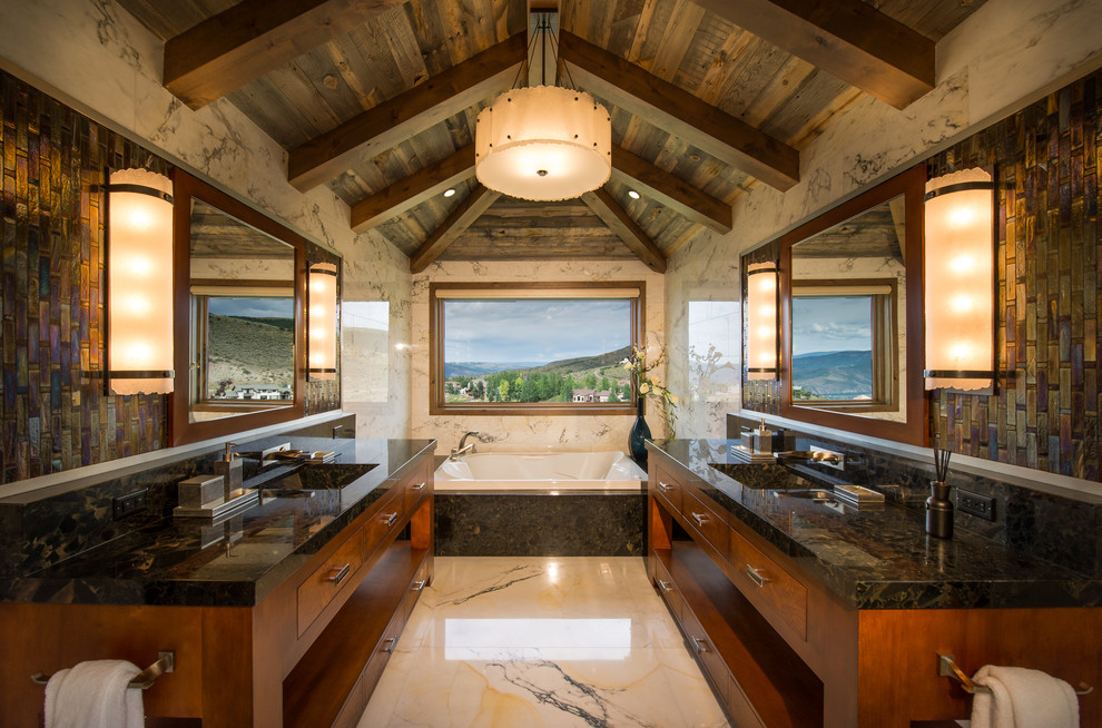 Drop-in bathtub - large rustic master marble tile and white tile marble floor and white floor drop-in bathtub idea with flat-panel cabinets, granite countertops, medium tone wood cabinets and an integrated sink