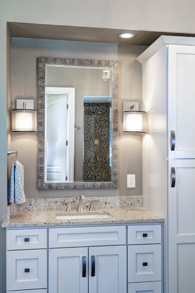 Inspiration for a transitional master bathroom in Columbus with an undermount sink, white cabinets, engineered quartz benchtops, a freestanding tub, a one-piece toilet, gray tile, wood-look tile, grey walls and ceramic floors.