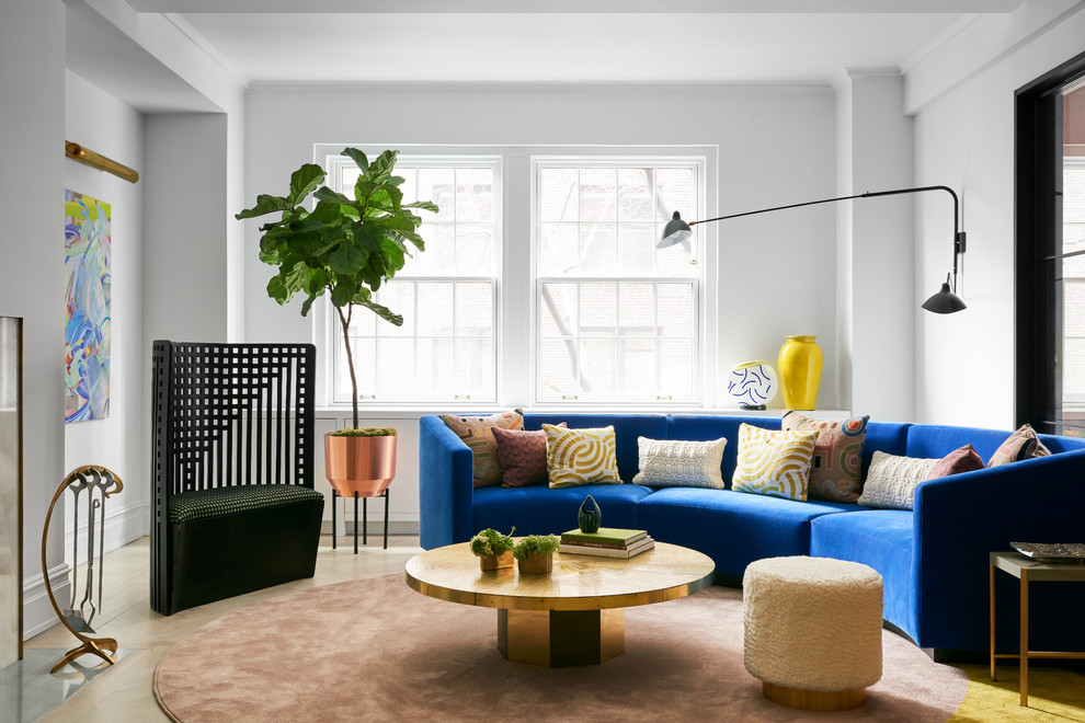 Example of a large trendy formal and enclosed light wood floor living room design in New York with white walls, no fireplace and no tv