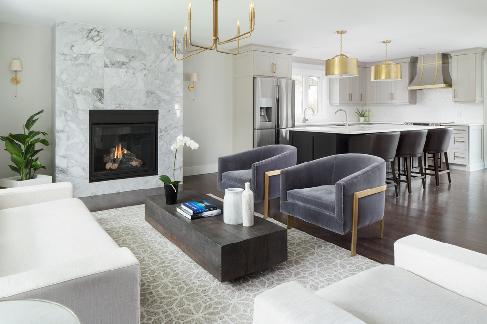 Inspiration for a transitional l-shaped kitchen remodel in Calgary with shaker cabinets, gray cabinets, white backsplash, porcelain backsplash, stainless steel appliances, an island and quartz countertops