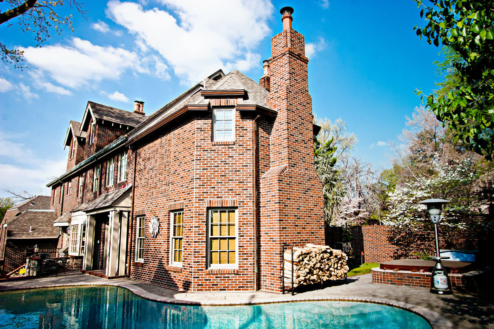Large mountain style backyard concrete and custom-shaped natural pool photo